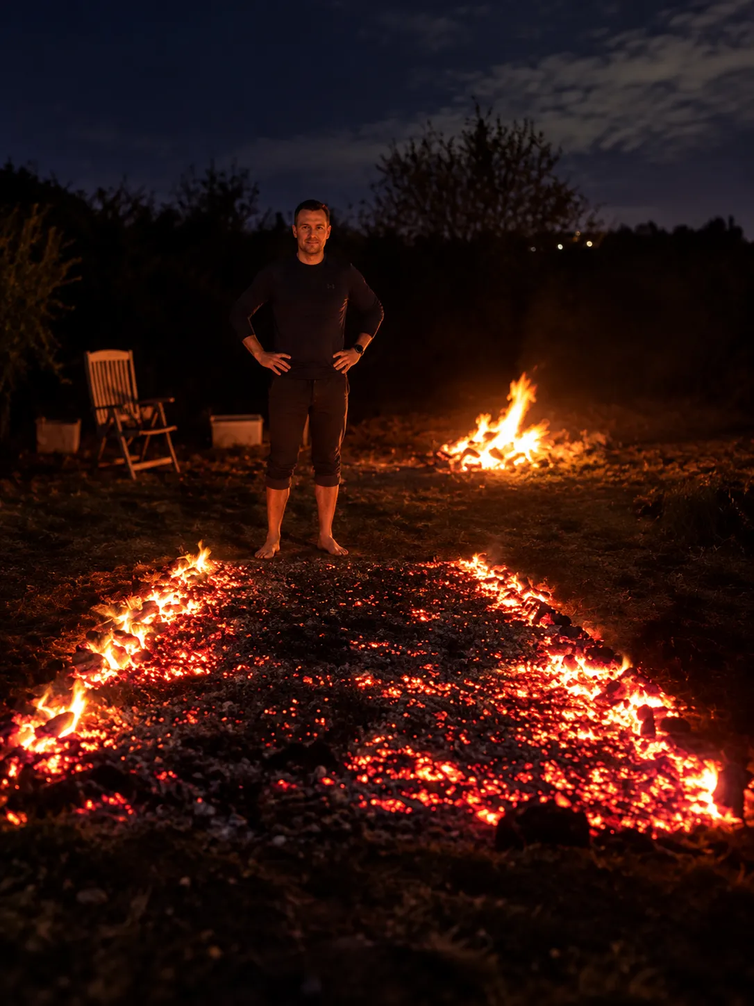 Jon taking part in a supervised firewalking exercise