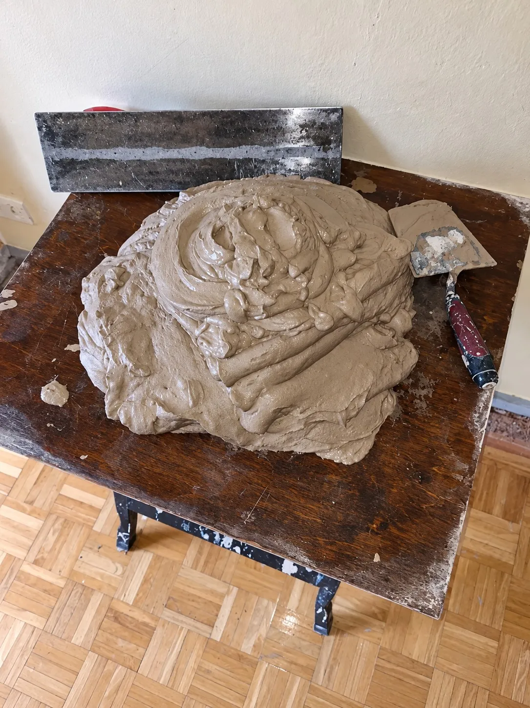 Freshly mixed plaster and tools during a home renovation